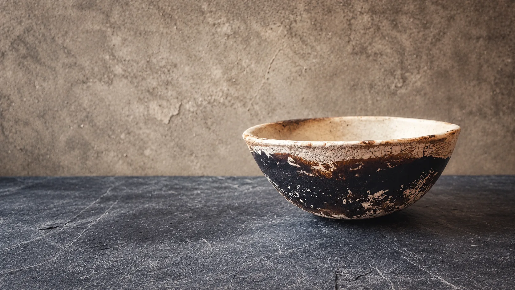 Raku-fired bowl in a quiet studio setting