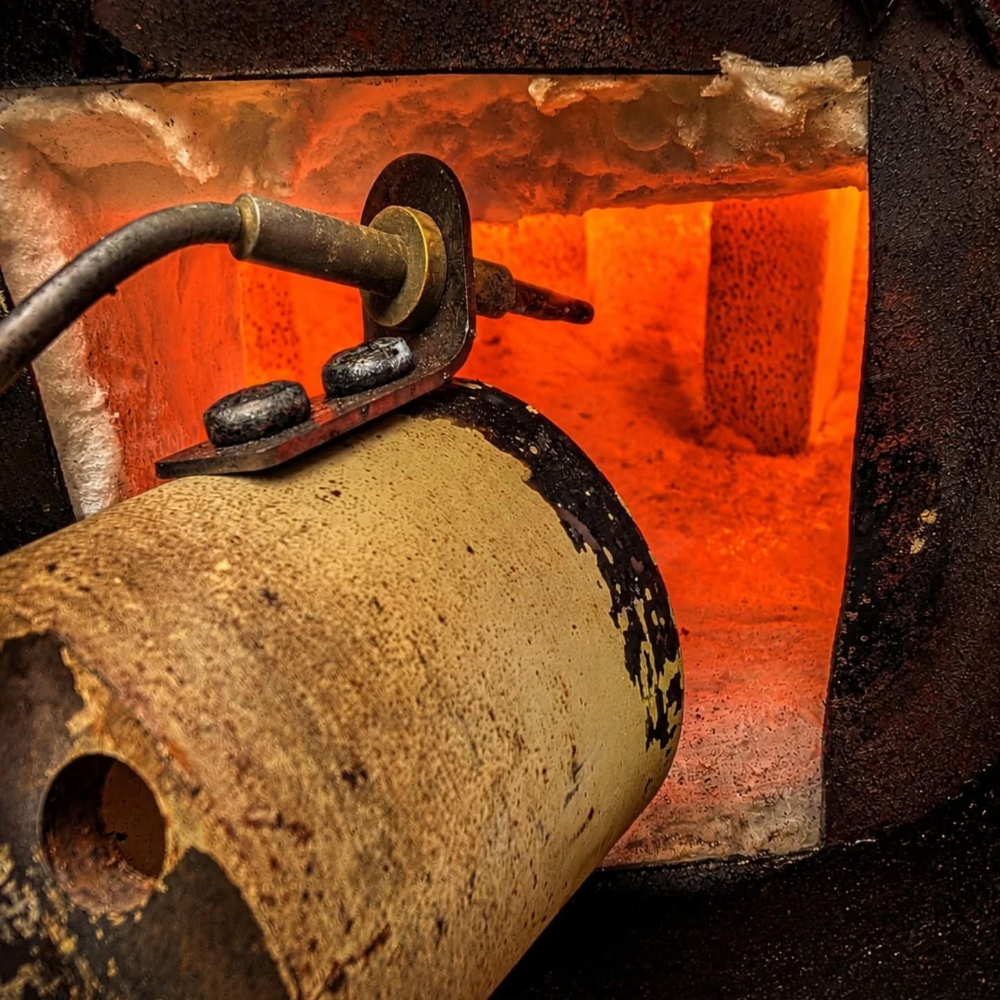 Raku kiln at temperature with orange heat and glow